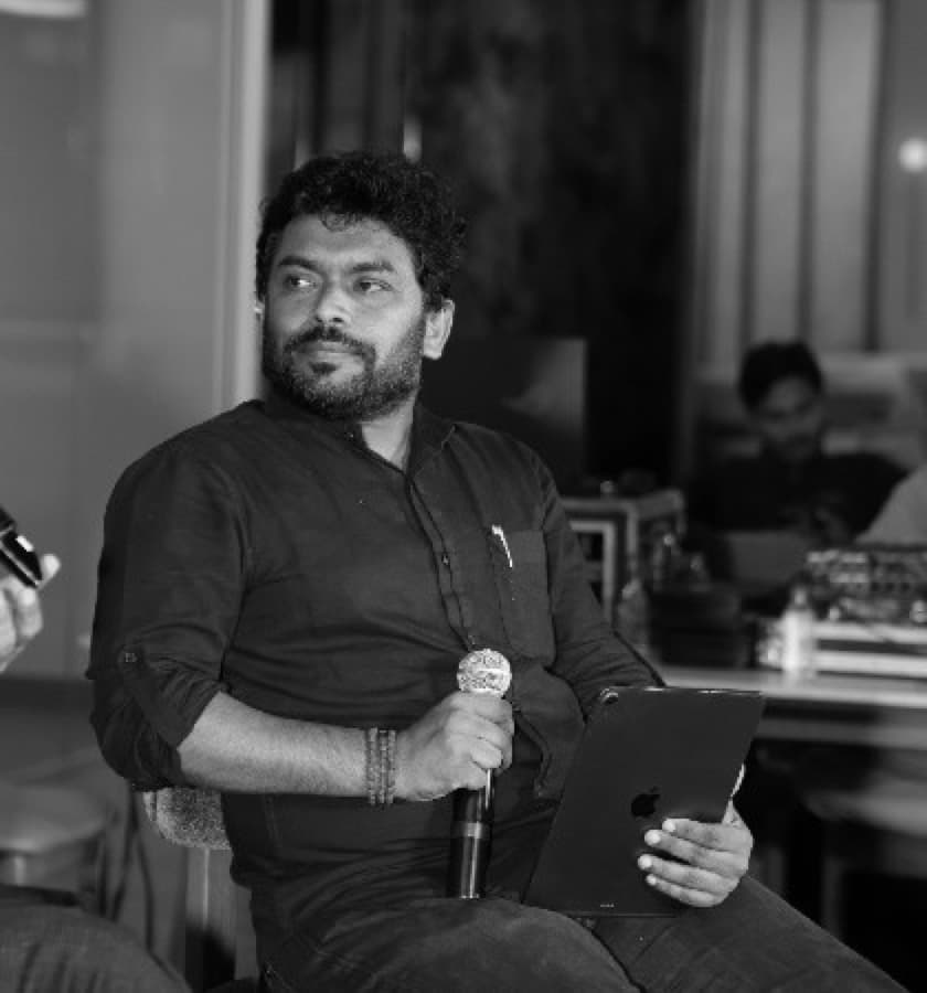 Pralhad Sonar, mic in hand at a tech conference